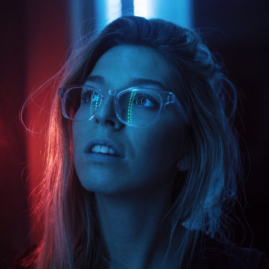 900x900 A woman looking at blue lights
