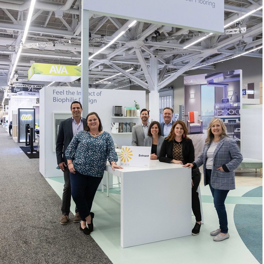 The Interface team standing in their trade show booth