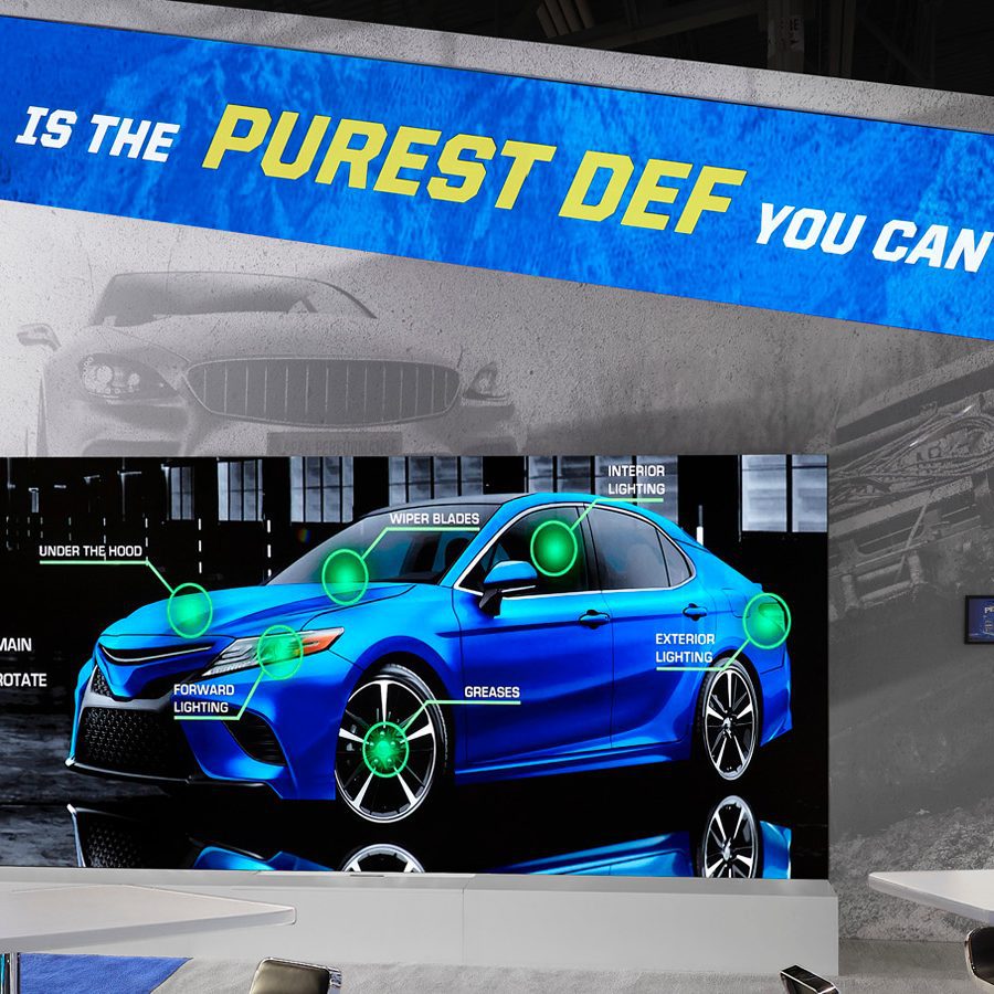 900x900 Peak trade show featuring a digital display
